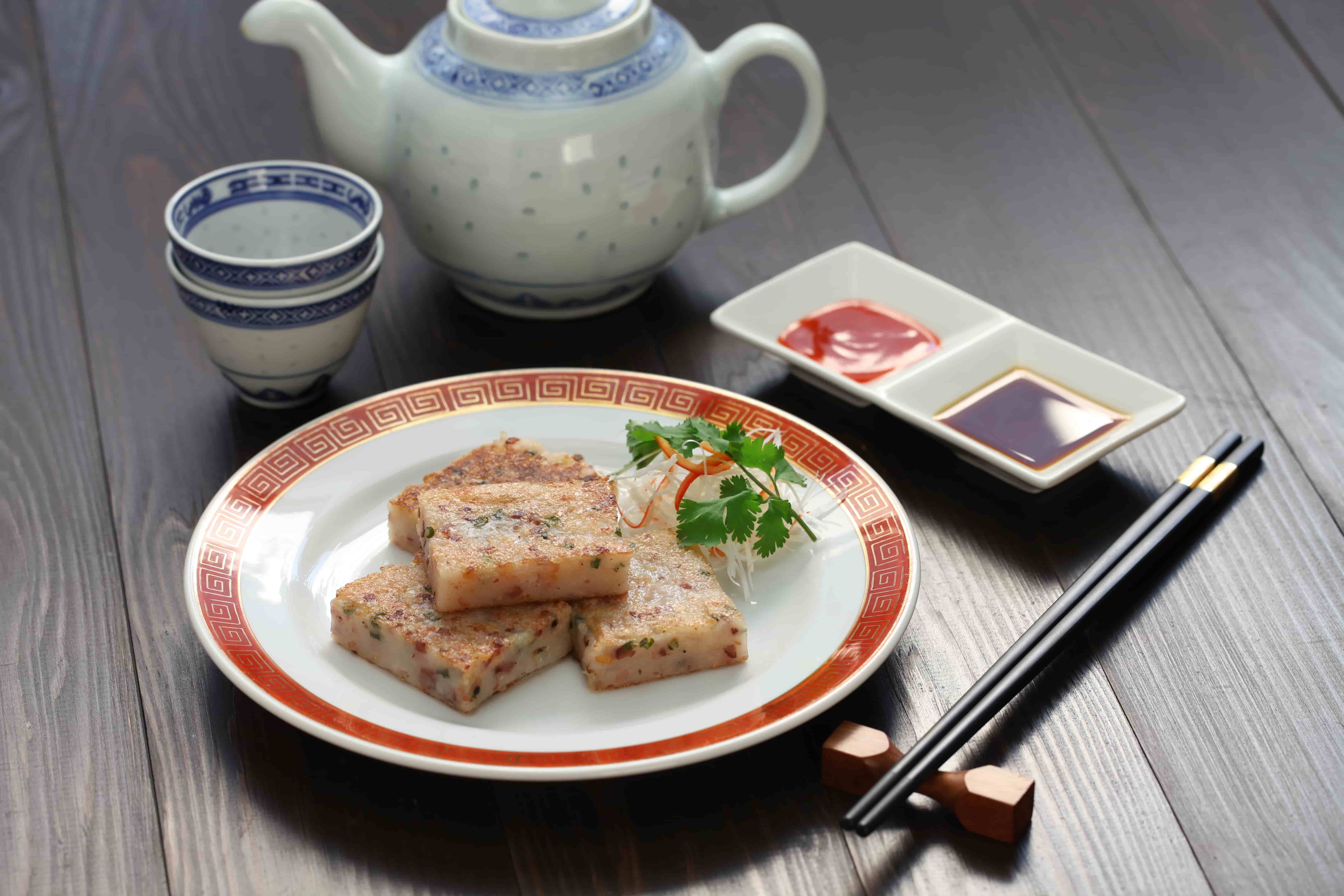 traditional Chinese meal served with chopsticks and tea in a hotel