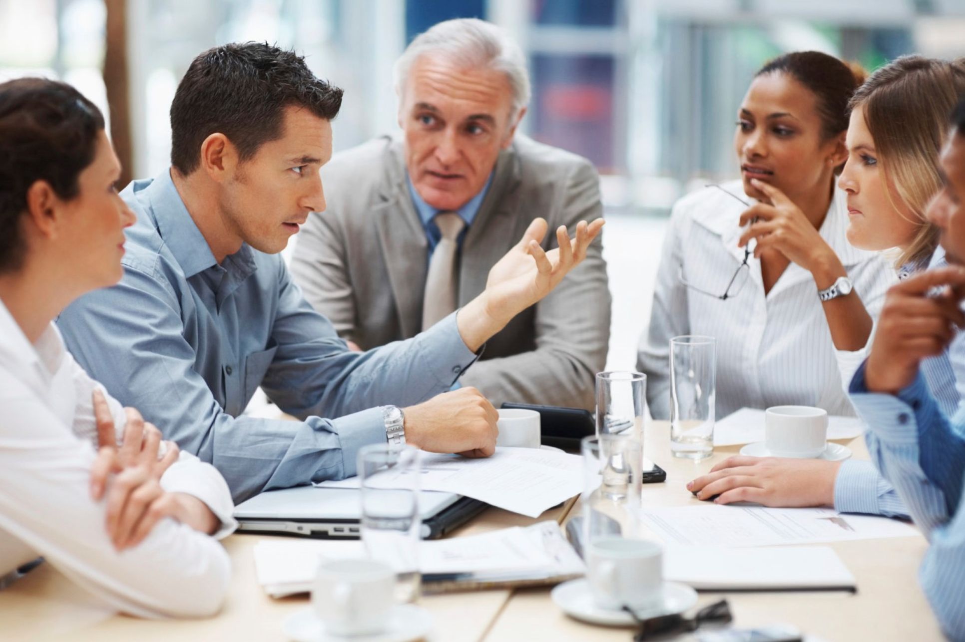 Multicultural team of 6 professionals working together