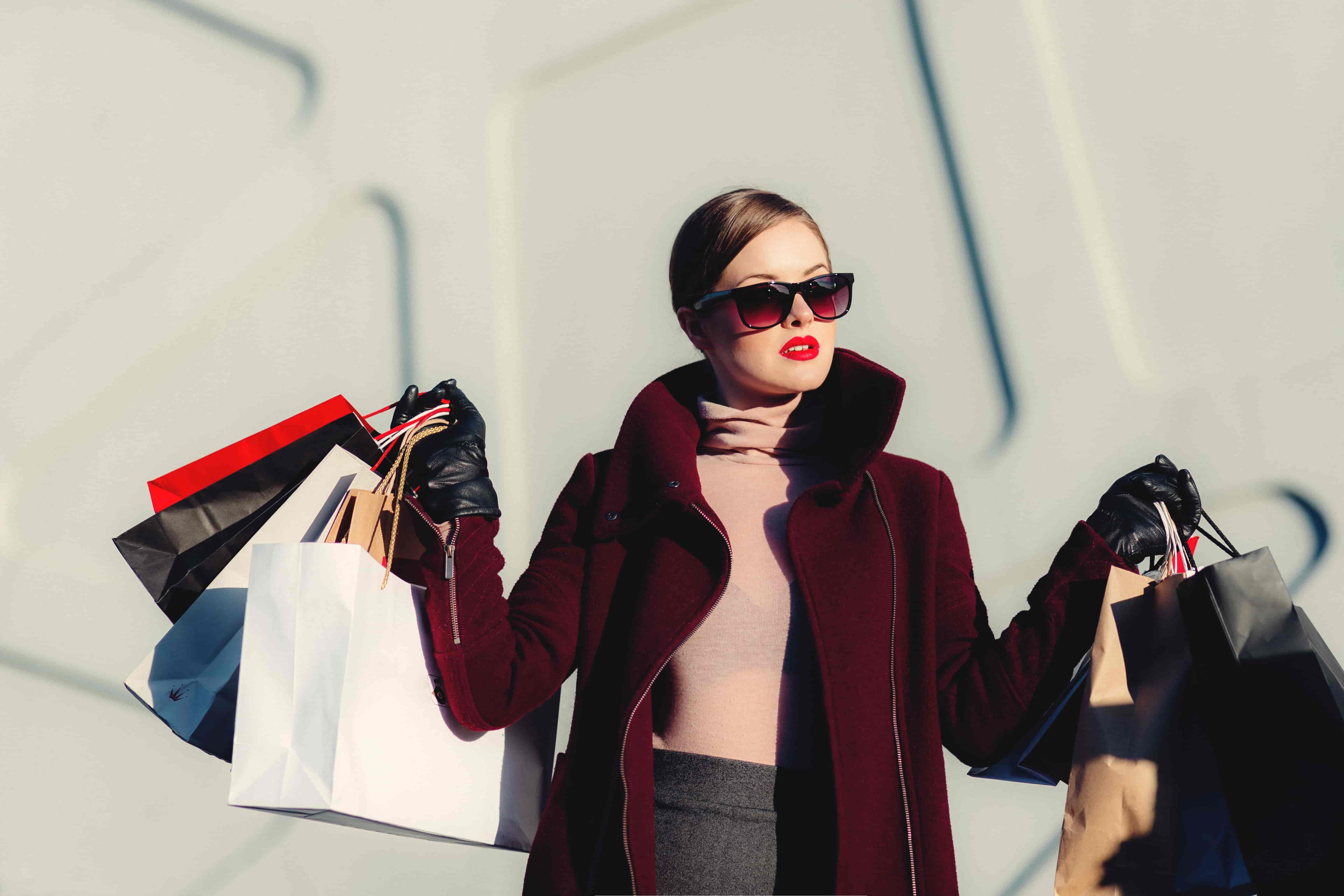 mystery shopper holding multiple shopping bags